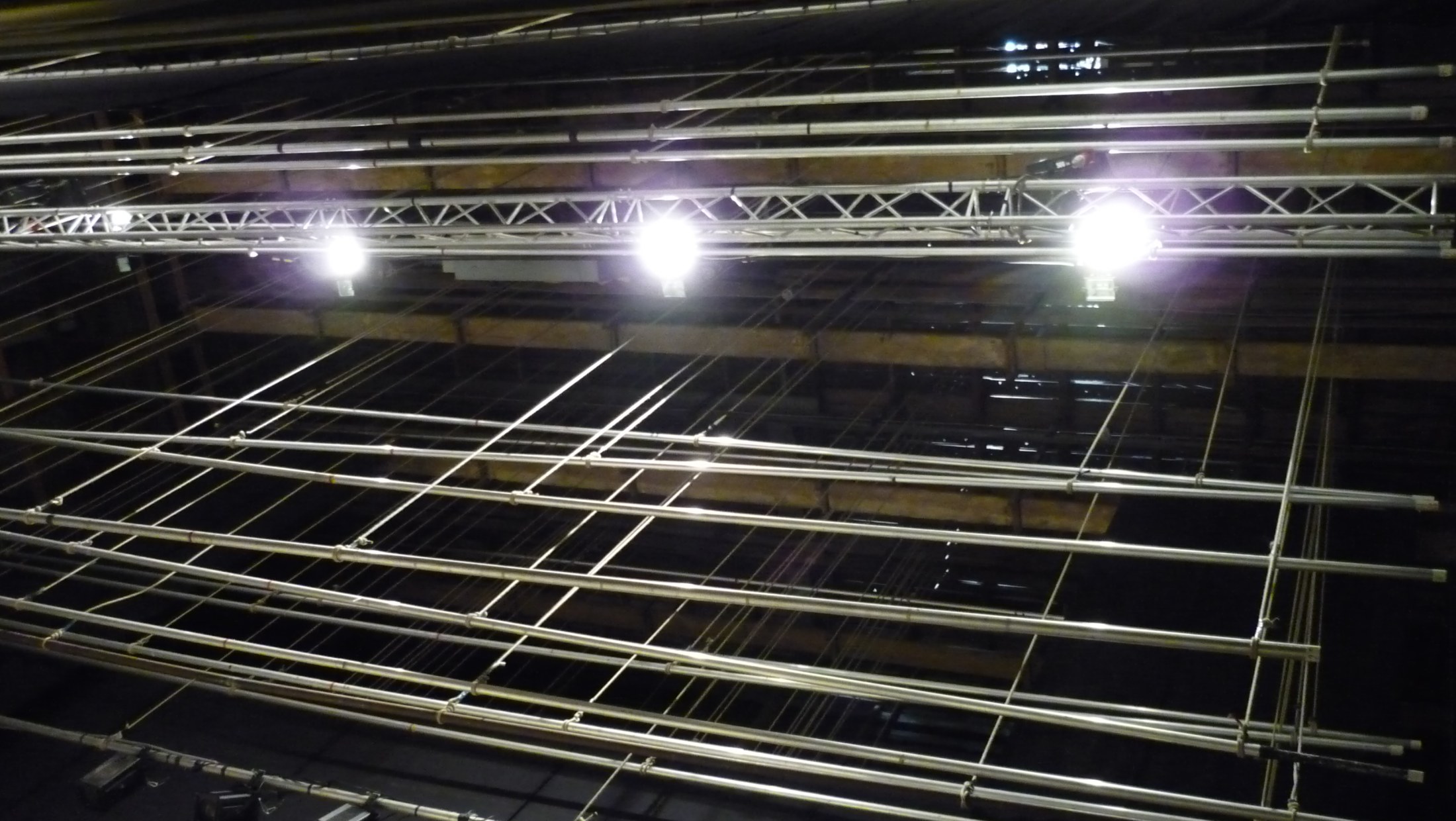 An empty auditorium seen from the stage during a technical rehearsal
