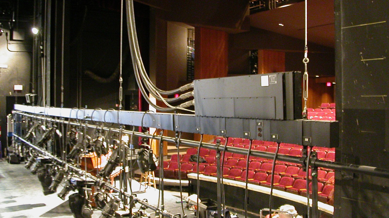 Lighting bars and lanterns seen from the auditorium
